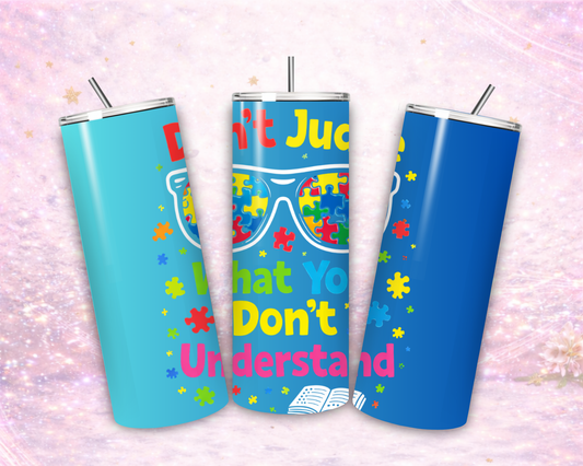 Colorful autism awareness tumbler with puzzle pieces and quote dont judge what you dont understand stainless steel cup