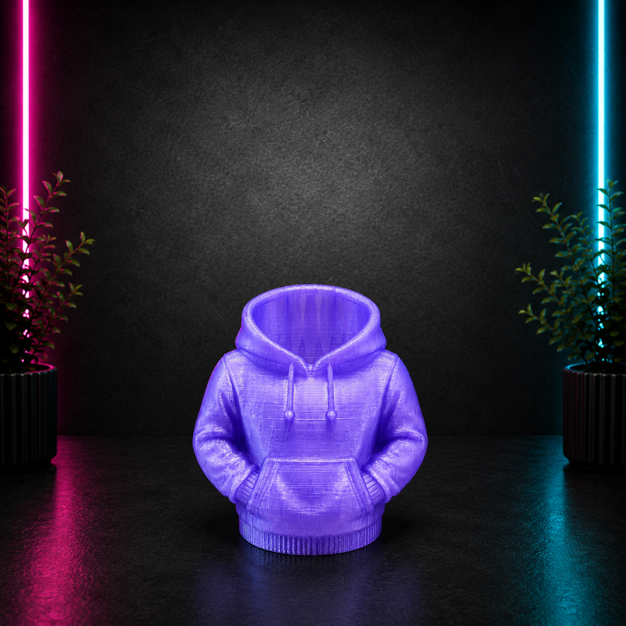 Purple hoodie-shaped planter holder on a dark neon background with pink and blue lighting for Chaotic Glow Studio Shopify product image.