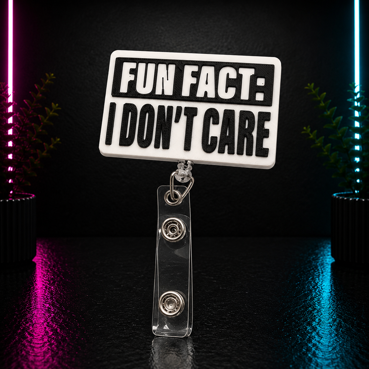 Black and white 3D printed "Fun Fact: I Don't Care" retractable badge reel with bold lettering for nurses, teachers, office staff, and healthcare professionals.