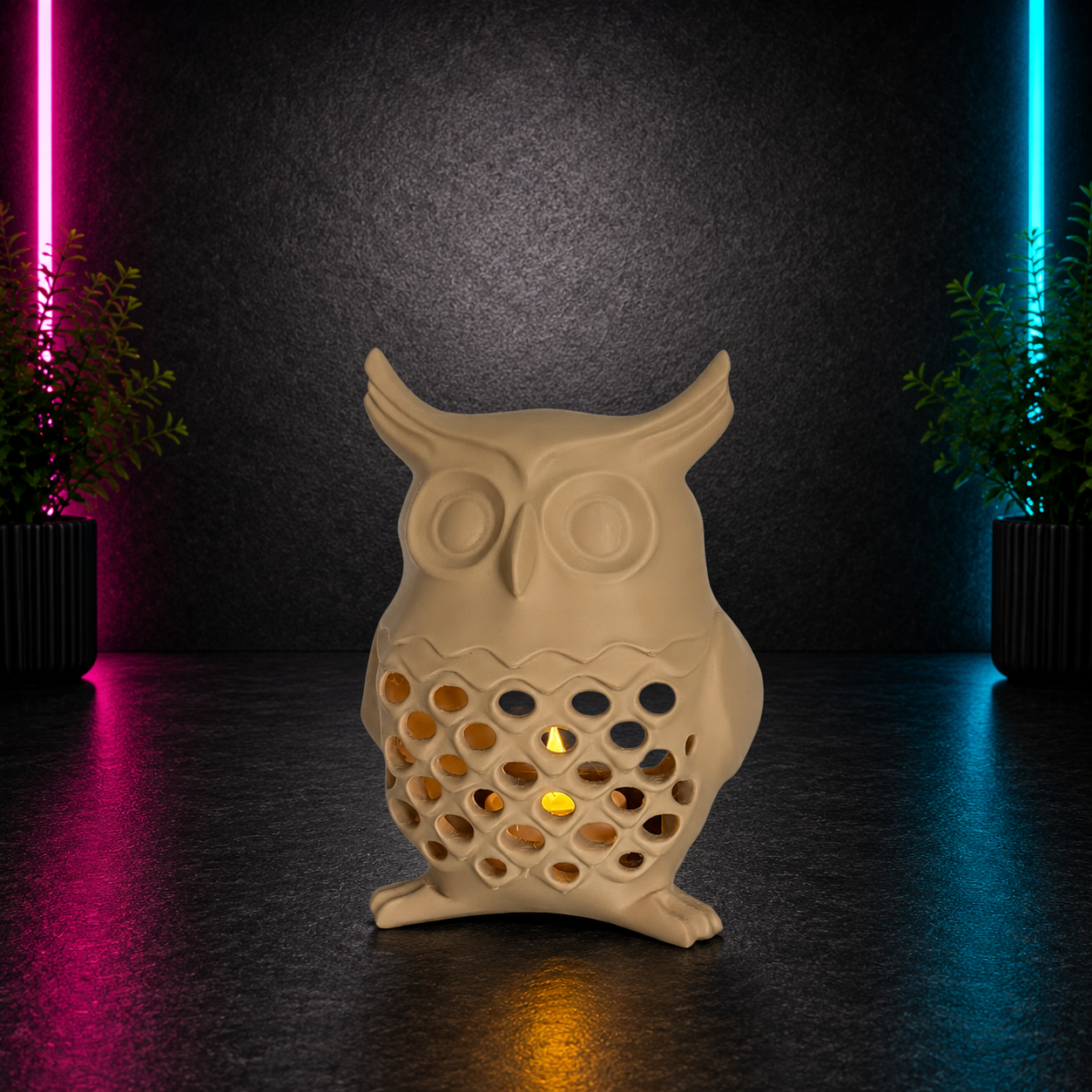 Beige owl tealight holder with glowing candle displayed on a dark neon pink and blue background by Chaotic Glow Studio.
